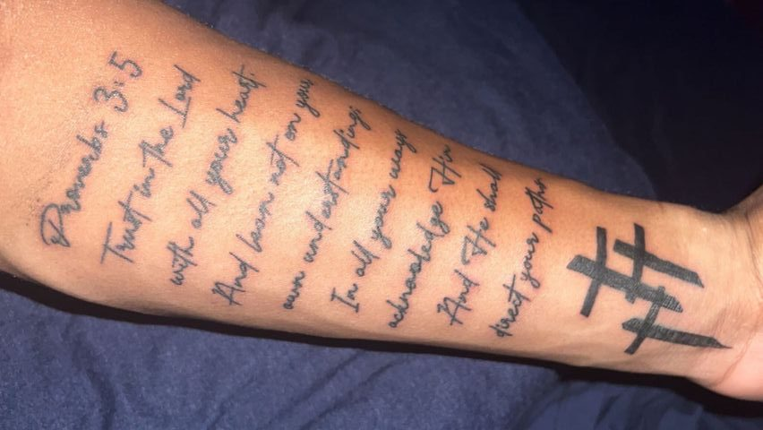 Full-sleeve tattoo of Bible verses